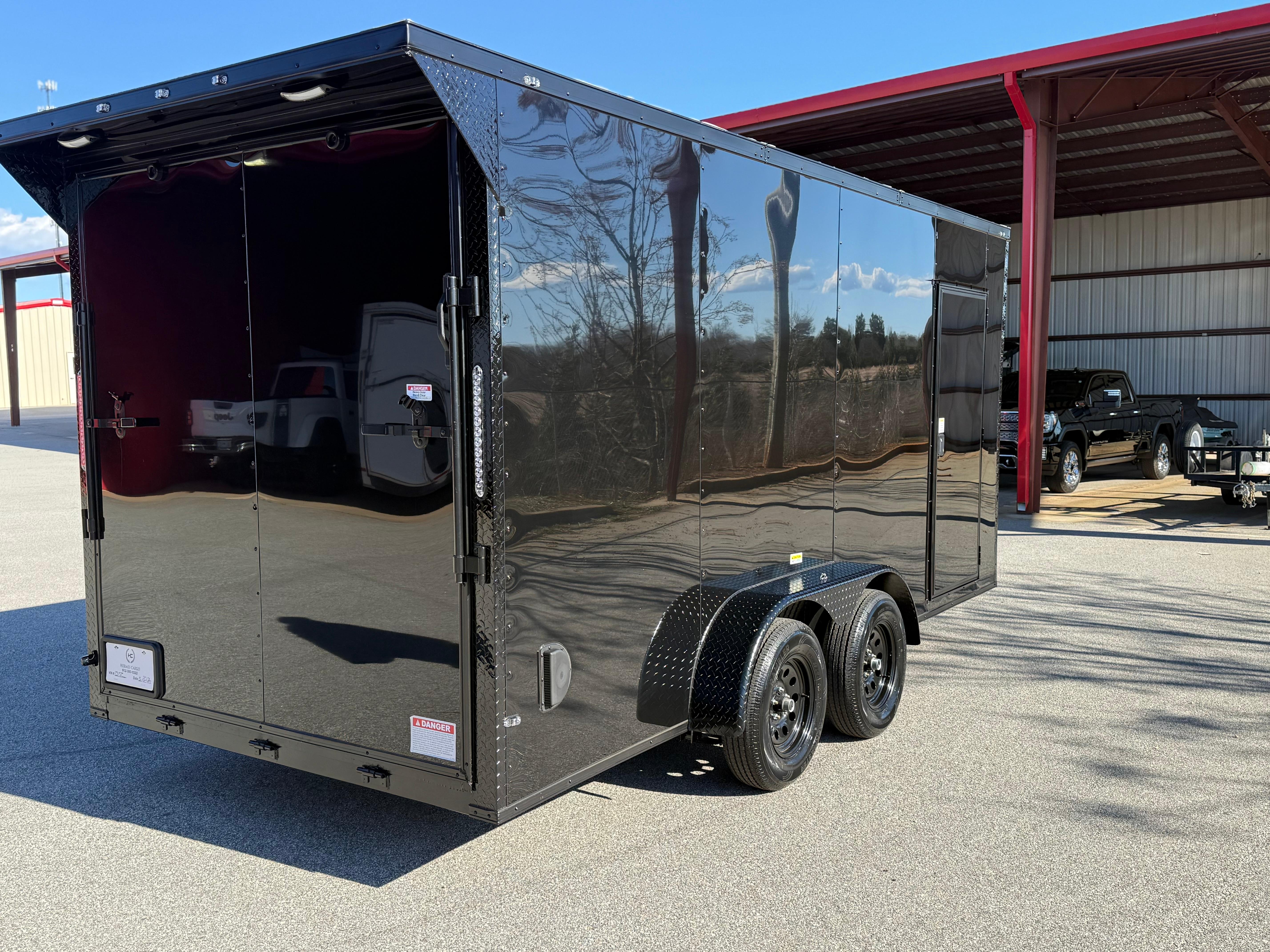 2026 Cargo United 7x16ft enclosed trailer — rear three-quarter view showing side door